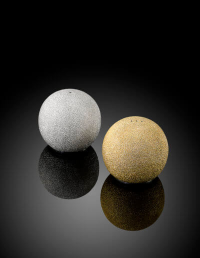 "Orb" Hand raised and textured salt and pepper shakers. Shown without base.