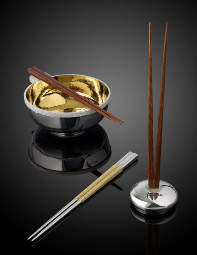 Oriental bowl and magnetic chopsticks. Group shot.