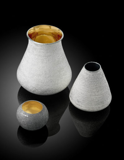Handraised and hand textured vase set.